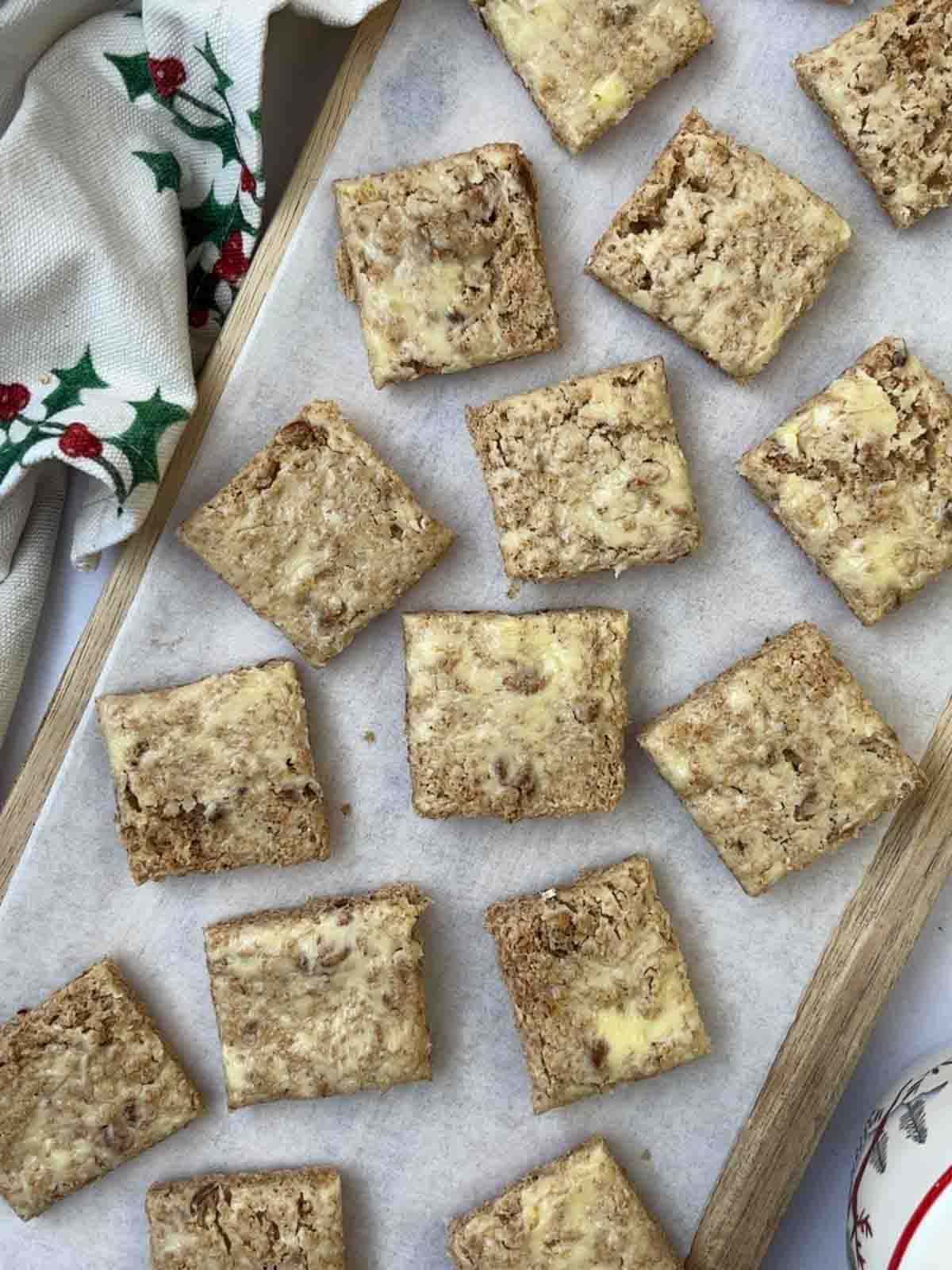 Squares of buttered brown bread to make Smoked Salmon Canapes.