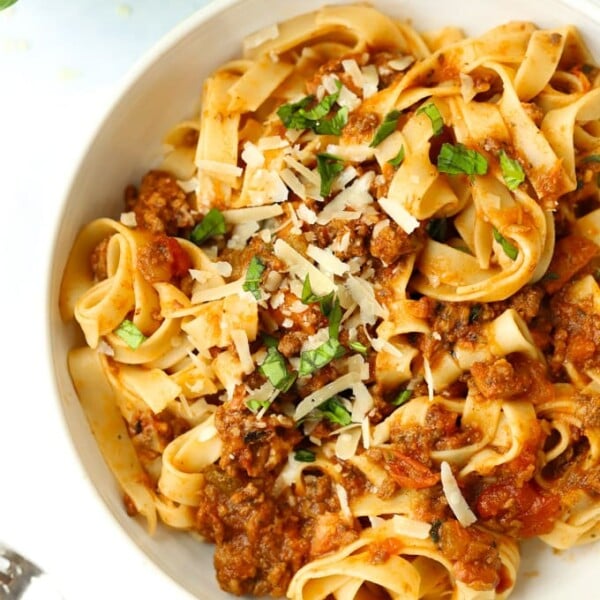 A bowl of bolognese and tagliatelle pasta.
