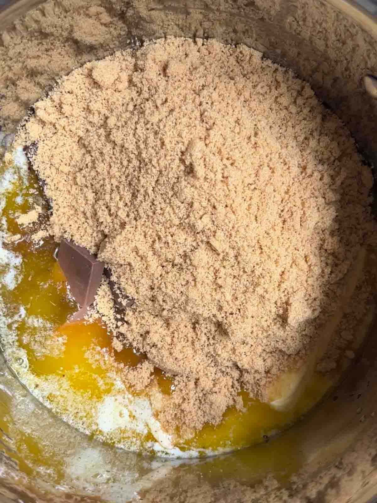Raw ingredients in a pan for chocolate orange brownies.