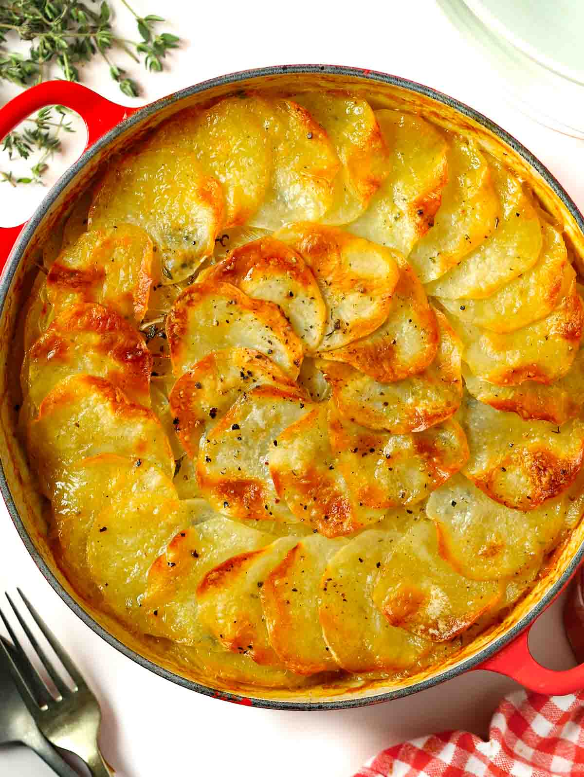 Boulangere potatoes baked in a dish in layers.