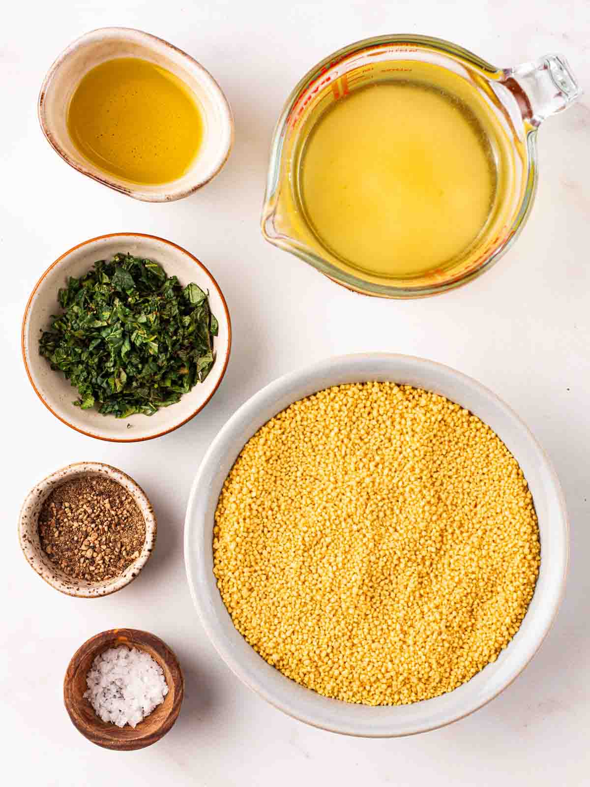 The ingredients for making couscous laid out on a counter top. A view from above.