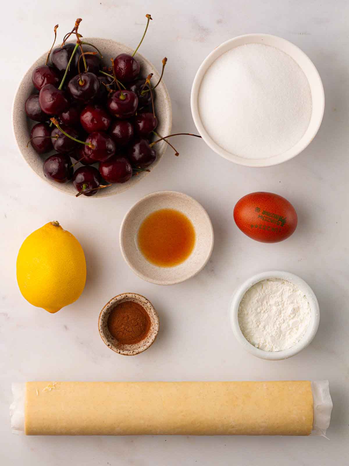 The ingredients for a Cherry Pie laid out on a counter top.