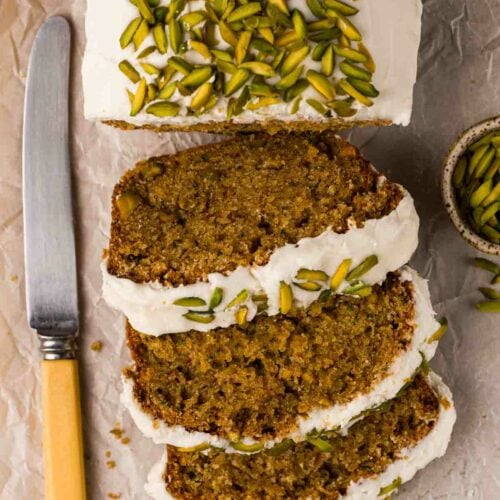 Sliced Courgette Cake from above with knife to the side.