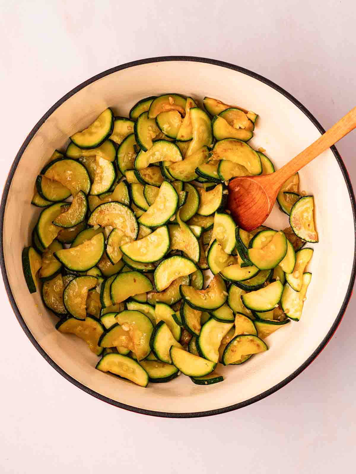 A pan with chopped courgette for step 1 in the recipe for Prawn Pasta.
