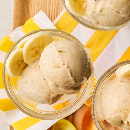 Three glass dessert bowls filled with Banana Nice Cream.