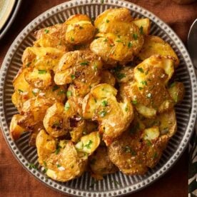 A bowl filled with golden, crispy Smashed potatoes.