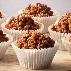 Rows of rice crispy cakes in cupcake cases, ready to eat.