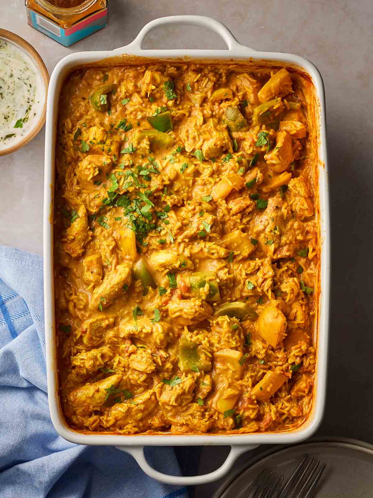 An oven dish with a Dump Bag recipe of Chicken Curry and Rice inside.