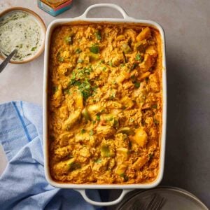 A one pan chicken curry and rice ready to serve on a table.
