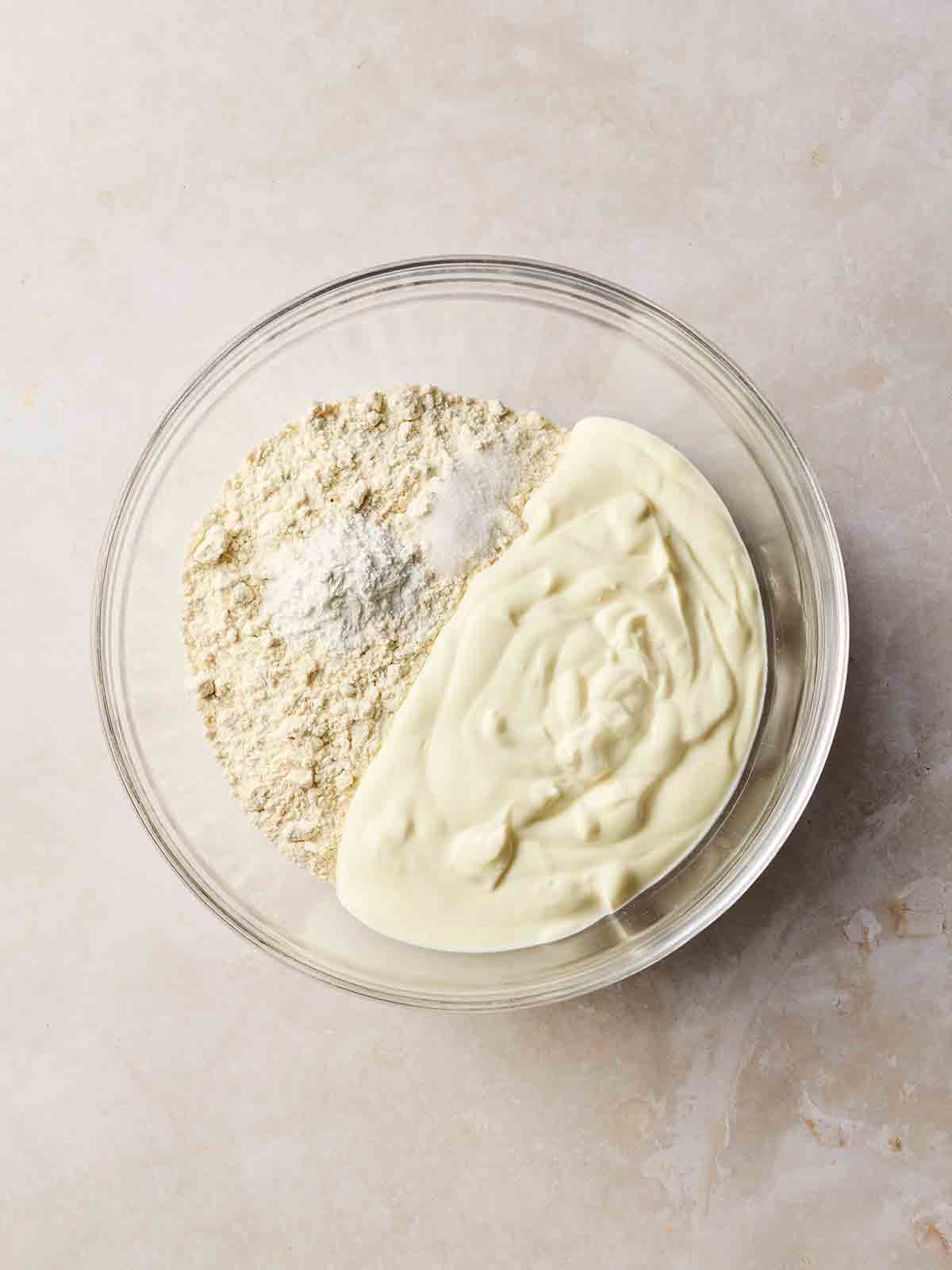 A bowl of ingredients for making flatbreads, ready to mix together.