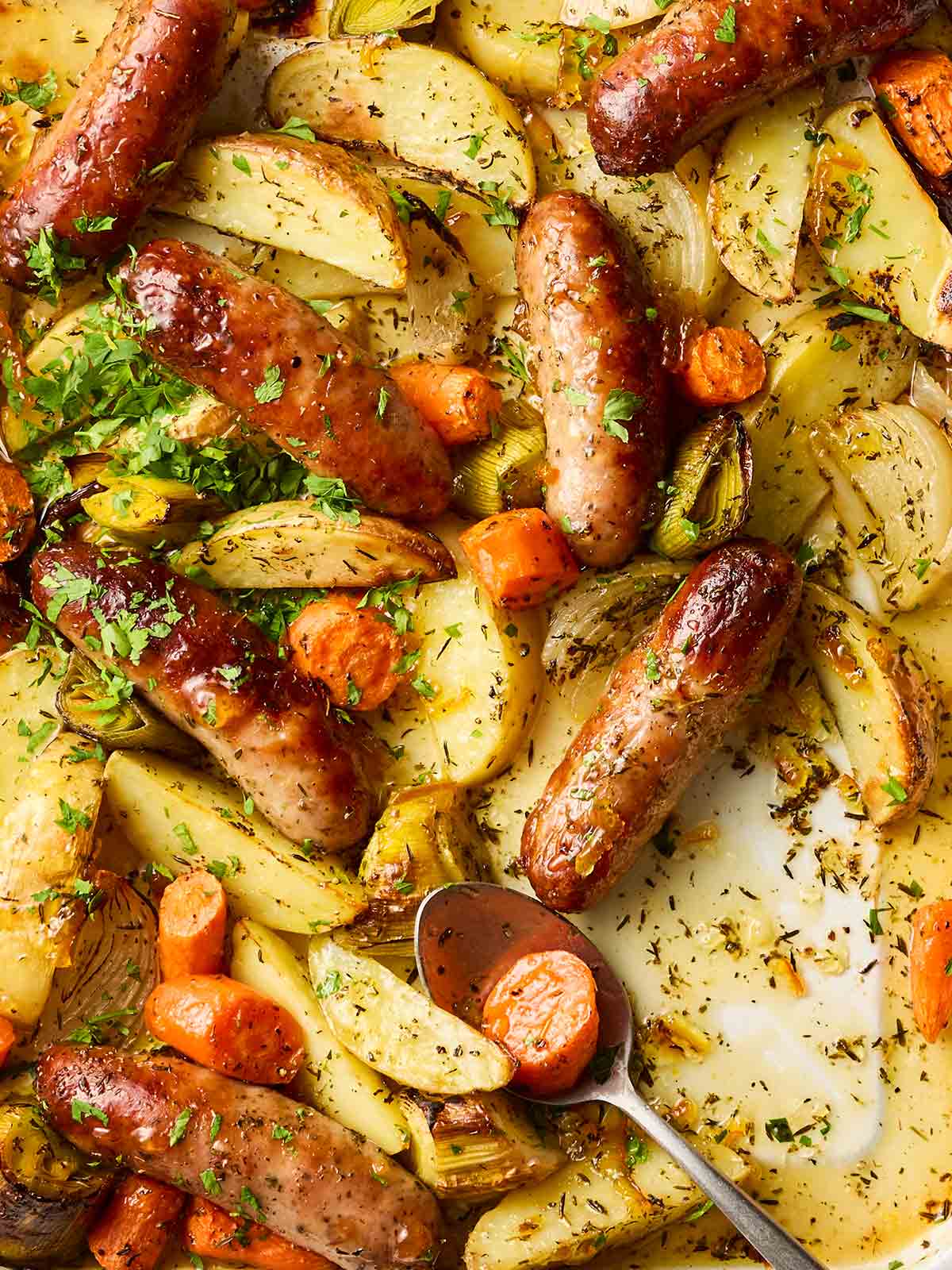 A close up of a sausage tray bake dinner.