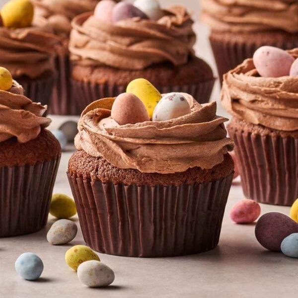 A close up of Easter Chocolate Cupcakes with mini eggs on top.