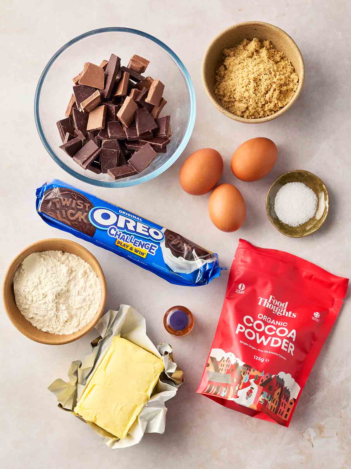 A ingredients for making Oreo Brownies laid out on a white surface.
