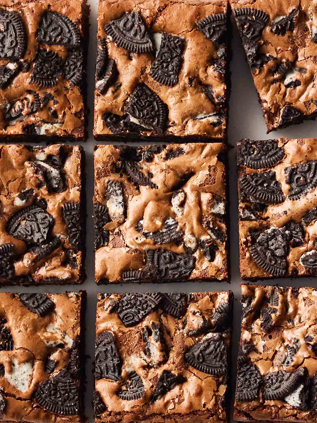 A close up of a batch of Oreo Brownies, cut into nine squares.