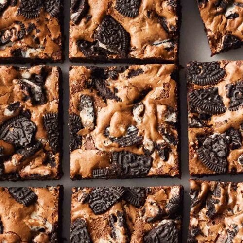 A batch of brownies with oreo cookies inside.