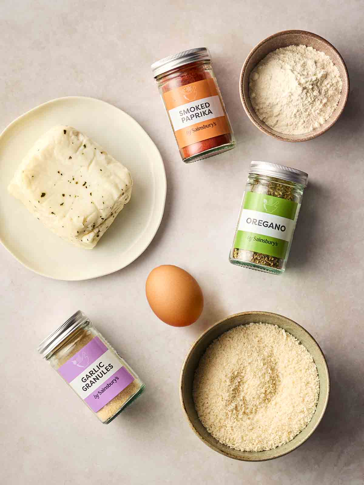 The ingredients for making Halloumi Fries laid out on a white counter top.