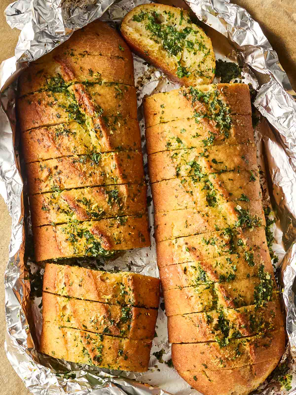 A foil package with homemade garlic bread inside.