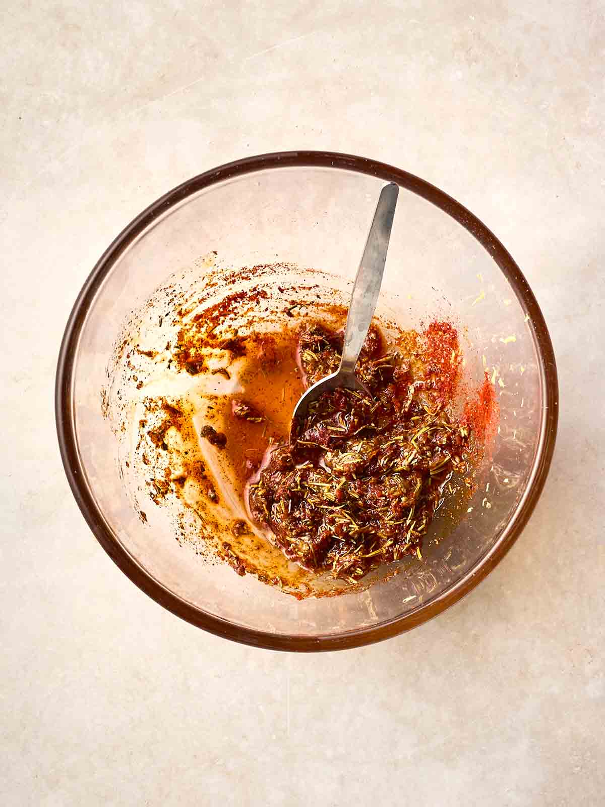 A glass bowl filled with glaze ingredients.